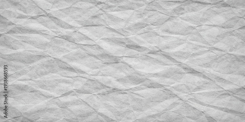 Crumpled white paper texture background with wrinkled rough surface and creased pattern