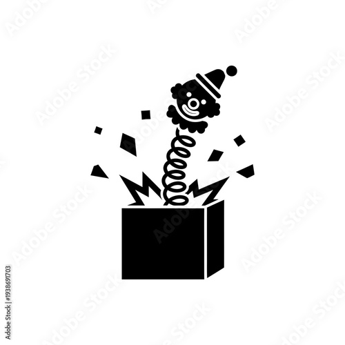 Surprised clown emerges from box with confetti and party hat