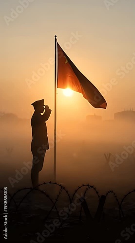 Silhouette of Soldier Saluting Flag at Sunrise in Misty Setting