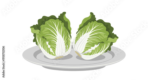 Two halves of fresh green Napa cabbage are neatly presented on a round grey plate against a white background.