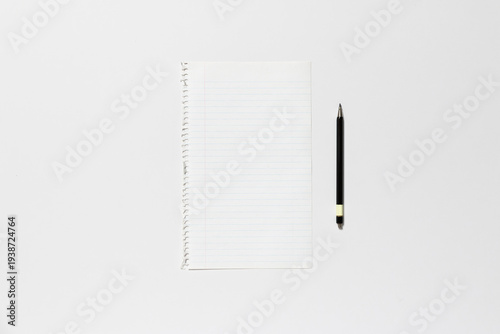 Ripped blank page of a spiral notepad on a white background.