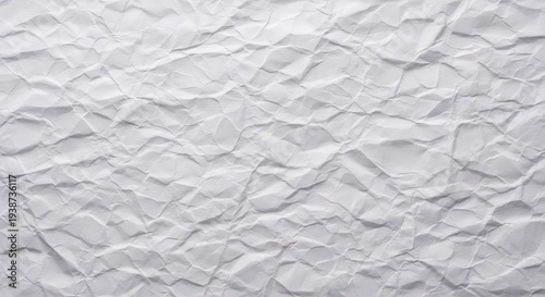 Close-up view of a delicate white paper surface, intricately crumpled with a fine grain texture, creating organic patterns and shadows, background, off white, light