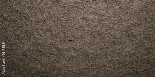 A vintage dark brown leather material surface features a rough textured pattern and macro skin details for an old grunge textile background wallpaper