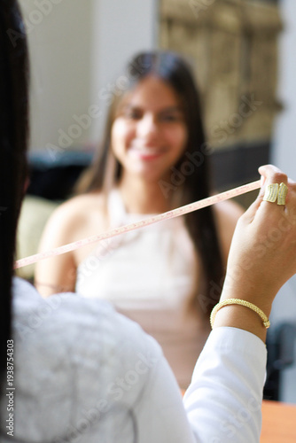 Nutritionist discussing diet and measuring progress with a smiling client in a wellness consultation