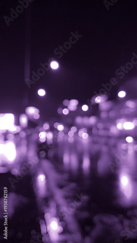 Blurred tranquil dreamy night city road at rain times in purple tone