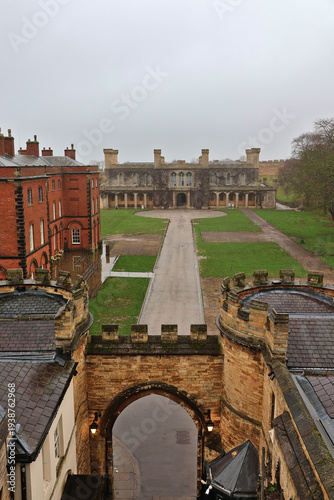 Lincoln Castle view toward Lincoln Crown Court; historic castle walls and former Victorian Prison building ahead of operational Courthouse, Lincoln, England, UK