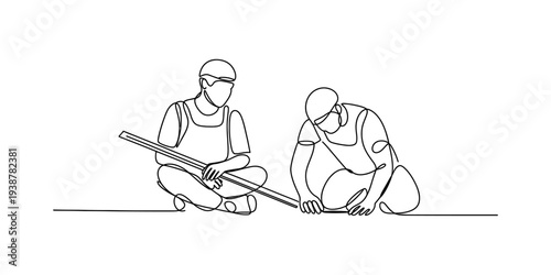 Two builders in uniform working together with measuring tape on white background