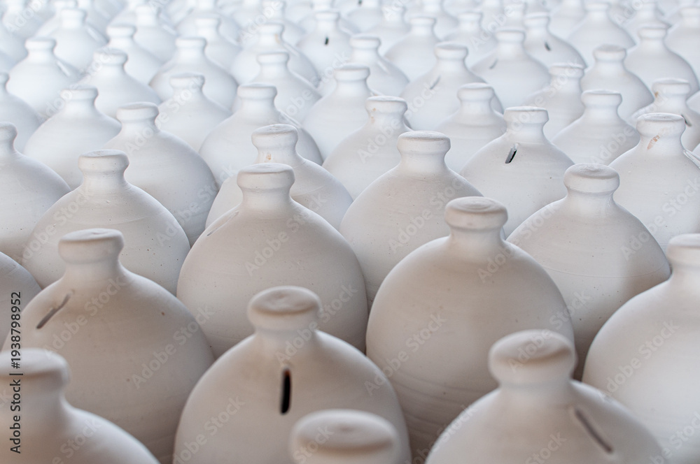 Fototapeta premium Bahrain’s traditional A’ali hand-crafted pottery. Close up of white clay jugs.