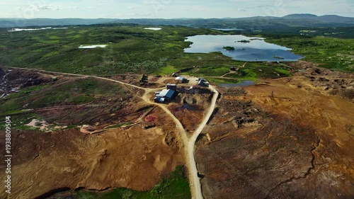 View of Storwartz mining area from an aerial perspective. This location is part of Røros Copper Works and Røros Mining Town in Norway, known for its historical significance, UNESCO World Heritage Site
