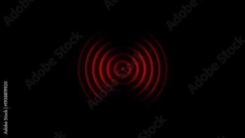 Concentric red glowing circles emanating outwards from a central point against a deep black background representing sound waves or a signal pulse