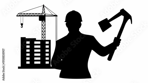 Construction worker with hard hat holding pickaxe near crane