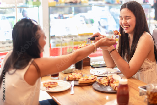 фотографія Young Woman Raising Hands in Excited Surprise While Looking at Pizza