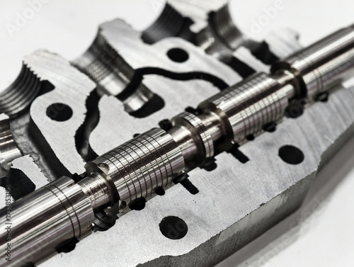 Detailed view of hydraulic valve components highlighting sectional cuts and internal mechanisms in a precision engineering context