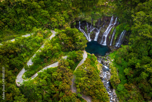 Grand Galet waterfall and road in aerial view with luxury green nature at Reunion Island