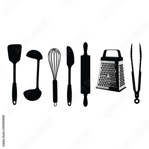 Kitchen utensils including spatula, whisk, and grater isolated on white background