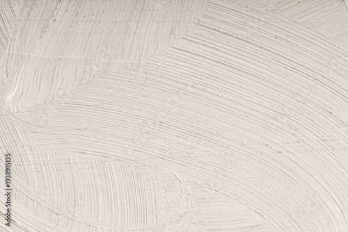 Fine texture of light coloured paint applied with a brush