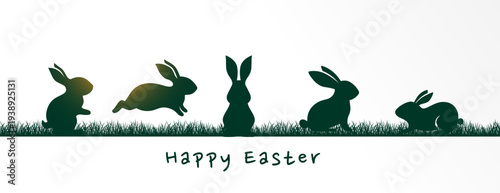 happy easter green bunny silhouettes in a grass field
