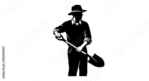 Man in hat holding shovel in black silhouette