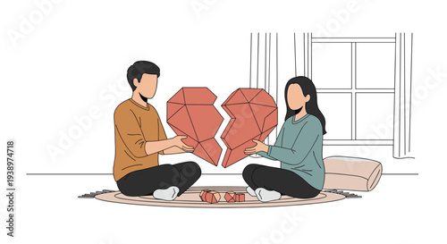 A couple sits on a rug in a minimalist room, holding the two geometric pieces of a large broken heart together in their hands.