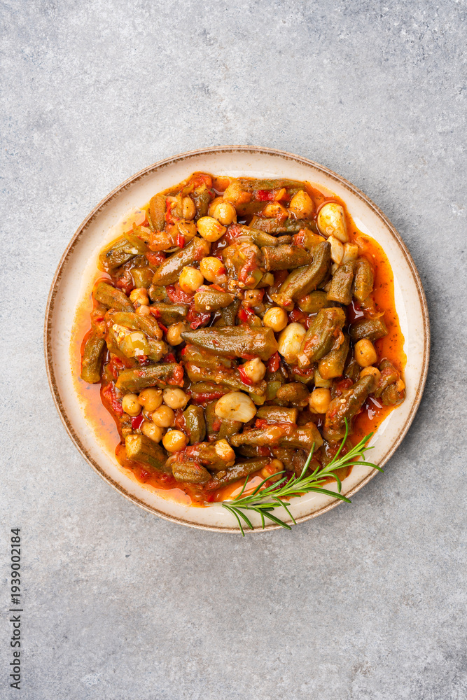 Fototapeta premium Freshly cooked okra dish on stone table background