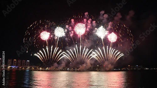 Colorful Fireworks Display Over Water City