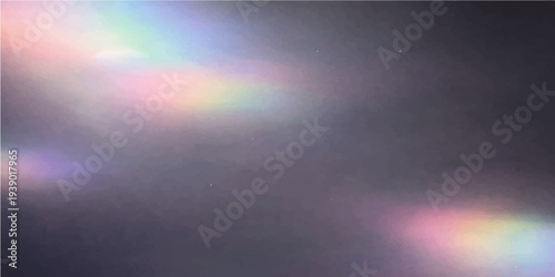 Abstract blue light rays pierce through a dark stormy sky and cloudy mist to create an atmospheric nature backdrop with a wet texture of rain and ocean smoke