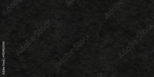 Abstract a monochromatic view of a fine-grained, dark, black stone wall, the texture of which adds a tactile and somber tone to any creative project.