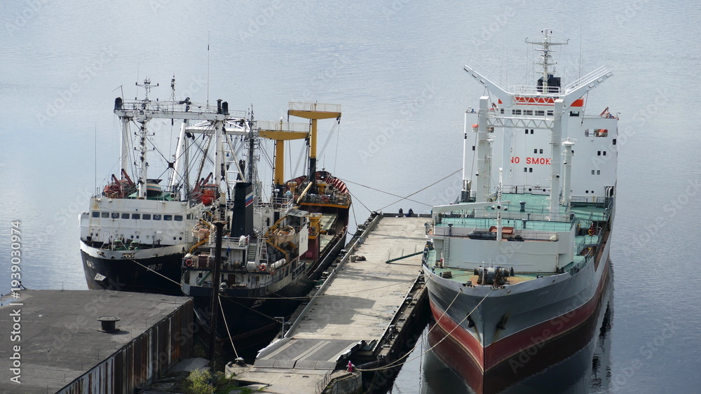 Naklejka premium Murmansk, RUSSIA - June 25, 2017: Ships in the Kola Bay. The usual daily life of the port city. Barents Sea, Gulf Stream.