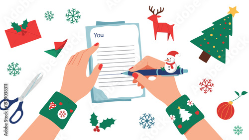 Top view of hands writing letter on paper surrounded by Christmas tree, reindeer, snowflakes, and festive holiday decorations on white background.