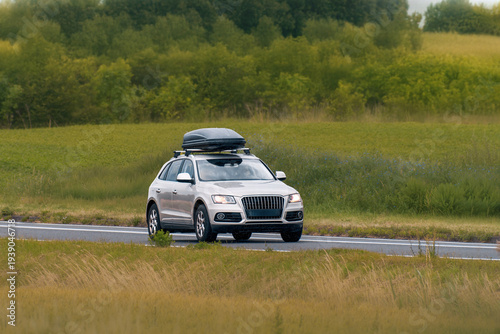 Wallpaper Mural Modern White Crossover Driving with Roof Cargo Carrier Torontodigital.ca