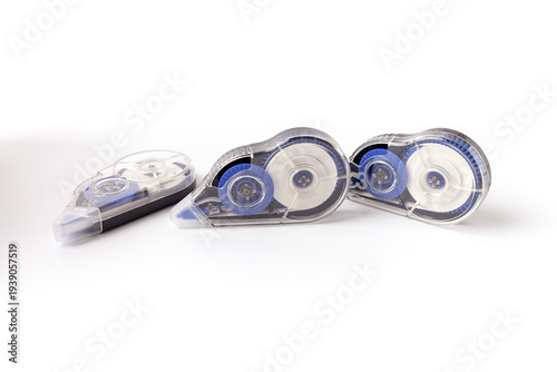 фотографія three correction tape rollers for school stationery and office supply catalogs