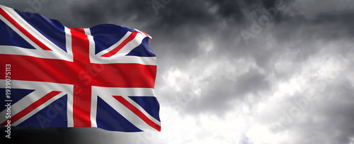 National flag of United Kingdom  with dark clouds in the background, 3D rendering