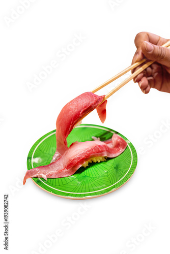 Top view of Fresh Tuna fish or Otoro with chopsticks in the red plate, focus selective