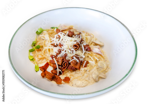 Die cut of Spaghetti carbonara with cheese and crispy bacon on white isolated.