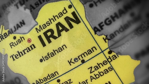 Close-up of Iran map showing Tehran and Mashhad on the map top view 4k footage, yellow highlighted area