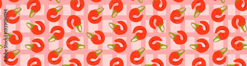 Seamless pattern with stylized red chili peppers on a pink checkered background. Playful vector illustration of vegetables for kitchen textiles, digital paper, food packaging and wallpaper.