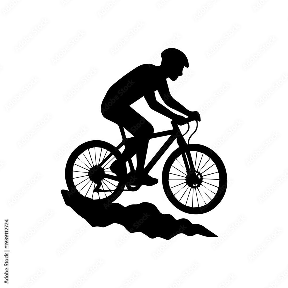 Obraz premium Mountain biker silhouette riding downhill on trails