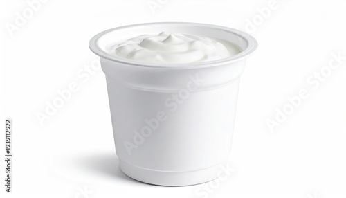 A cup of creamy white dairy product, with a swirling top, on a white background