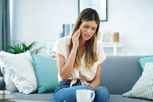 Tableau sur toile Toothache, sad and woman with pain on sofa, gum inflammation and dental problem for mouth discomfort