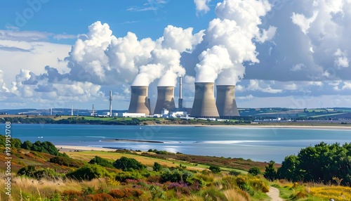 Industrial cooling towers emitting steam against a cloudy sky
