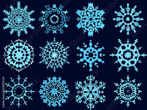 Collection of intricately designed blue and white snowflakes on a dark background