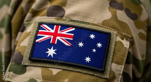 Close-up of Australian flag patch on camouflage military uniform, symbolizing patriotism and service