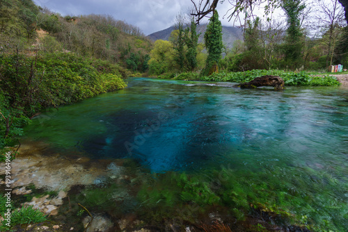 Picturesque turquoise water spring Blue Eye or Syri i Kalter in beautiful green landscape, Muzine, Albania