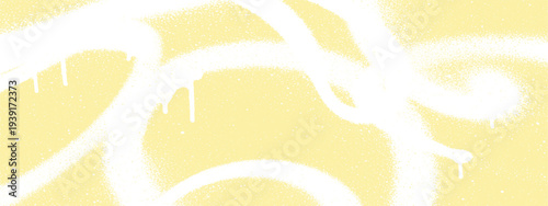 Pale yellow background with abstract white spray paint strokes and drips, subtle texture