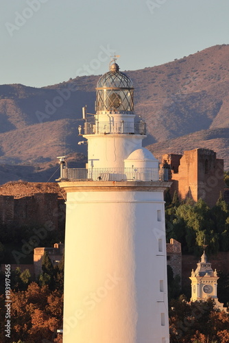 A view of the lighthouse of Malaga. The lighthouse is an iconic 19th-century lighthouse located at the entrance to the Port of Malaga.