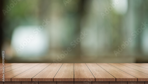 Empty wooden table top with lights bokeh on blur restaurant background.