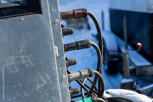 Εκτύπωση καμβά Multiple heavy duty cable connectors attached to metal control box, black cords