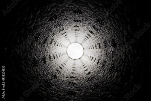 Abstract geometric texture with tunnel perspective and luminous center