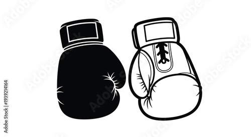 Two boxing gloves displayed one dark and one light a striking silhouette