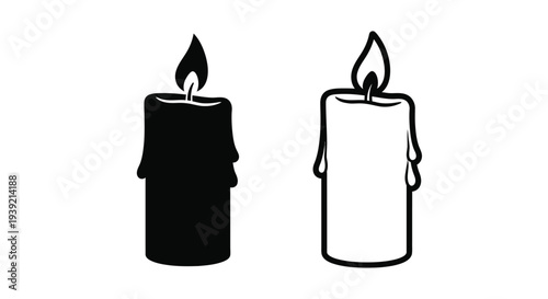 Two contrasting candles one dark and one light in silhouette